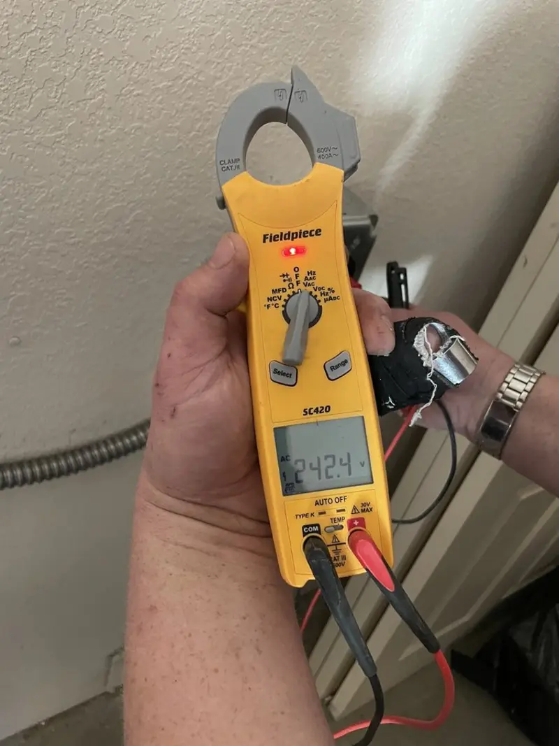 Voltage testing with clamp meter during Ceiling Fan Installation in Goshen